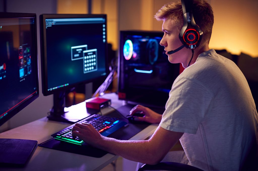 male-teenage-hacker-sitting-in-front-of-computer-s-EEKM8ZL.jpg